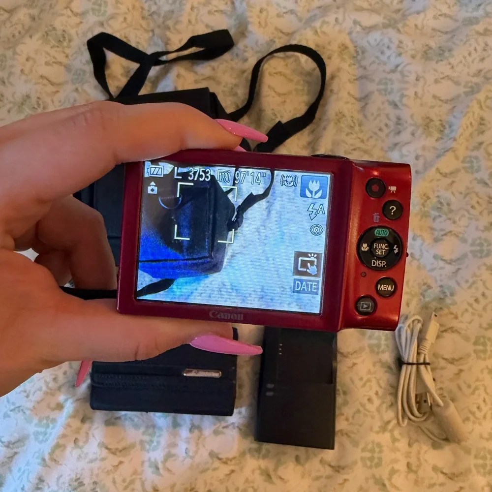 Canon Red Digital Camera with Black Accessories